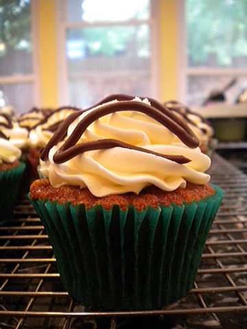 Banana cupcake filled with chocolate ganache, finished with cream cheese frosting and chocolate ganache